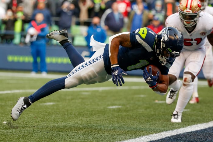 Seattle Seahawks wide receiver D'Wayne Eskridge (1) scores a touchdown reception against the San Francisco 49ers during the second quarter at Lumen Field.
